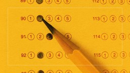 A sharpened pencil marks the first option on a multiple-choice answer sheet with a yellow background.