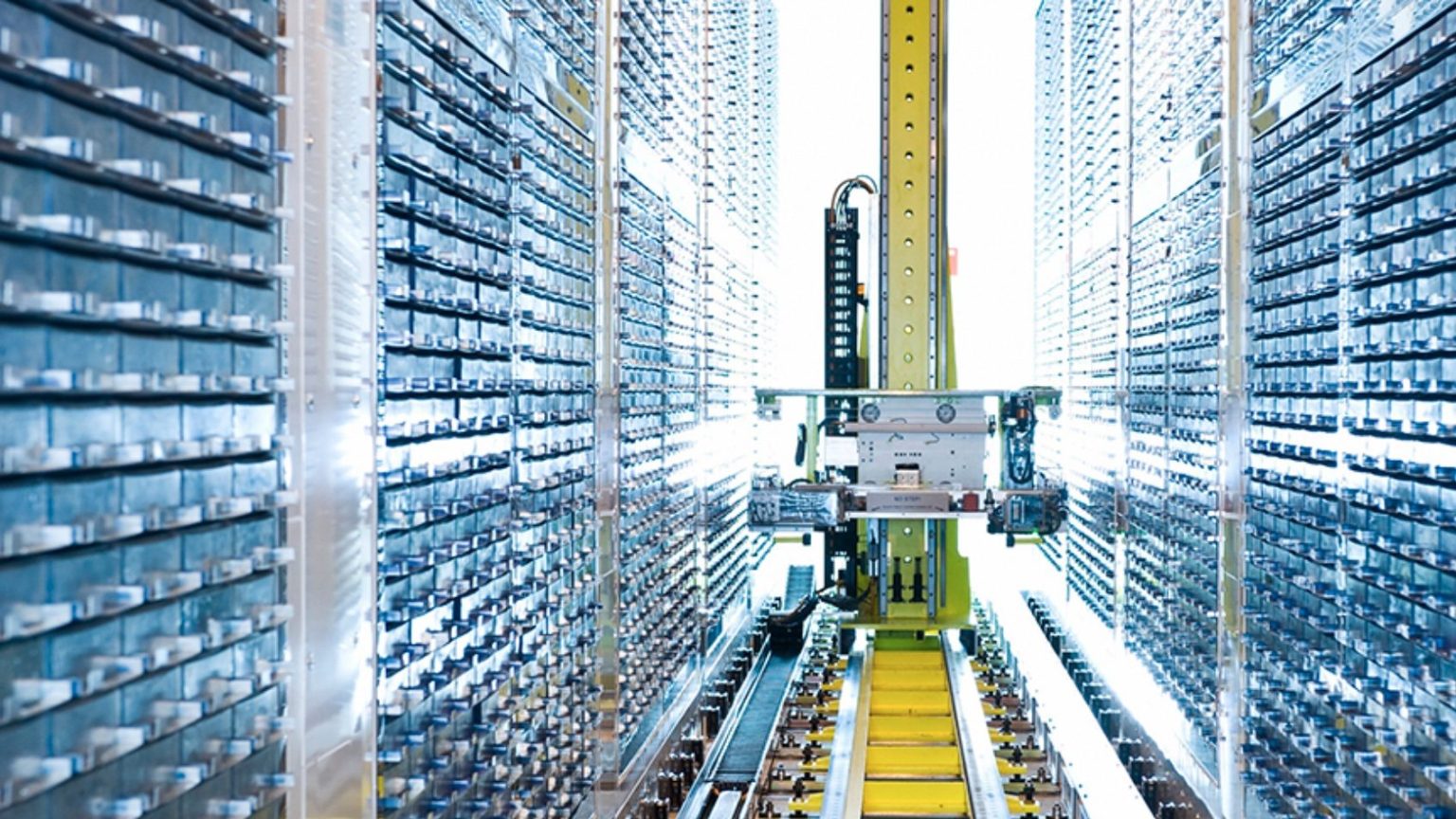 A machine is moving down a conveyor belt in a warehouse.